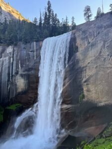 Large, powerful waterfall in yosemite at sunrise