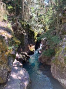 teal blue gorge in glacier national park